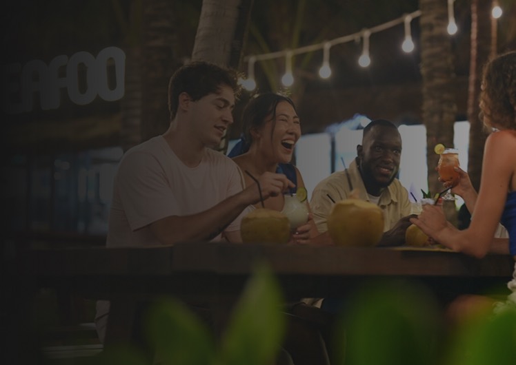 Friends sharing drinks at a bar